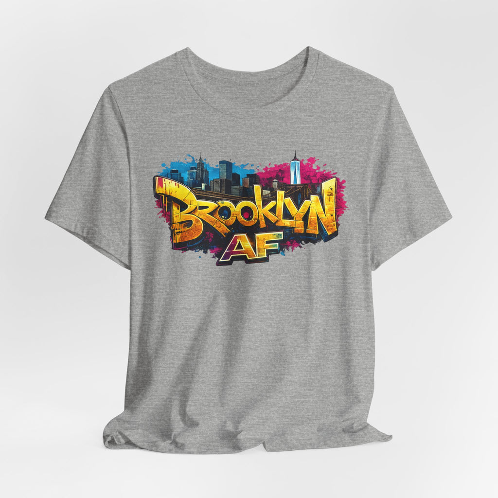 Athletic Heather t-shirt, front view flat lay, with graffiti-style Brooklyn AF lettering over a skyline splash.