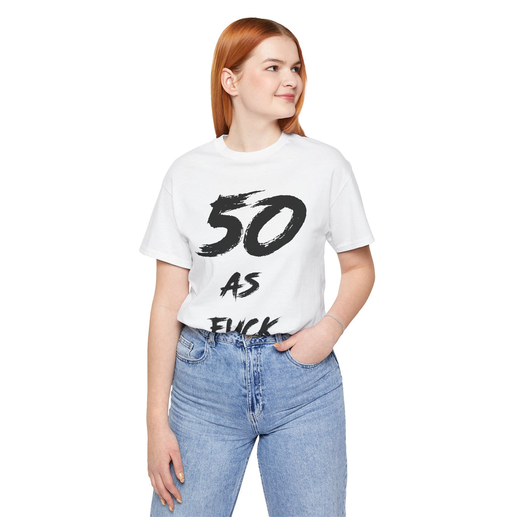 Woman wearing the white 50 AS FUCK birthday tee with blue jeans