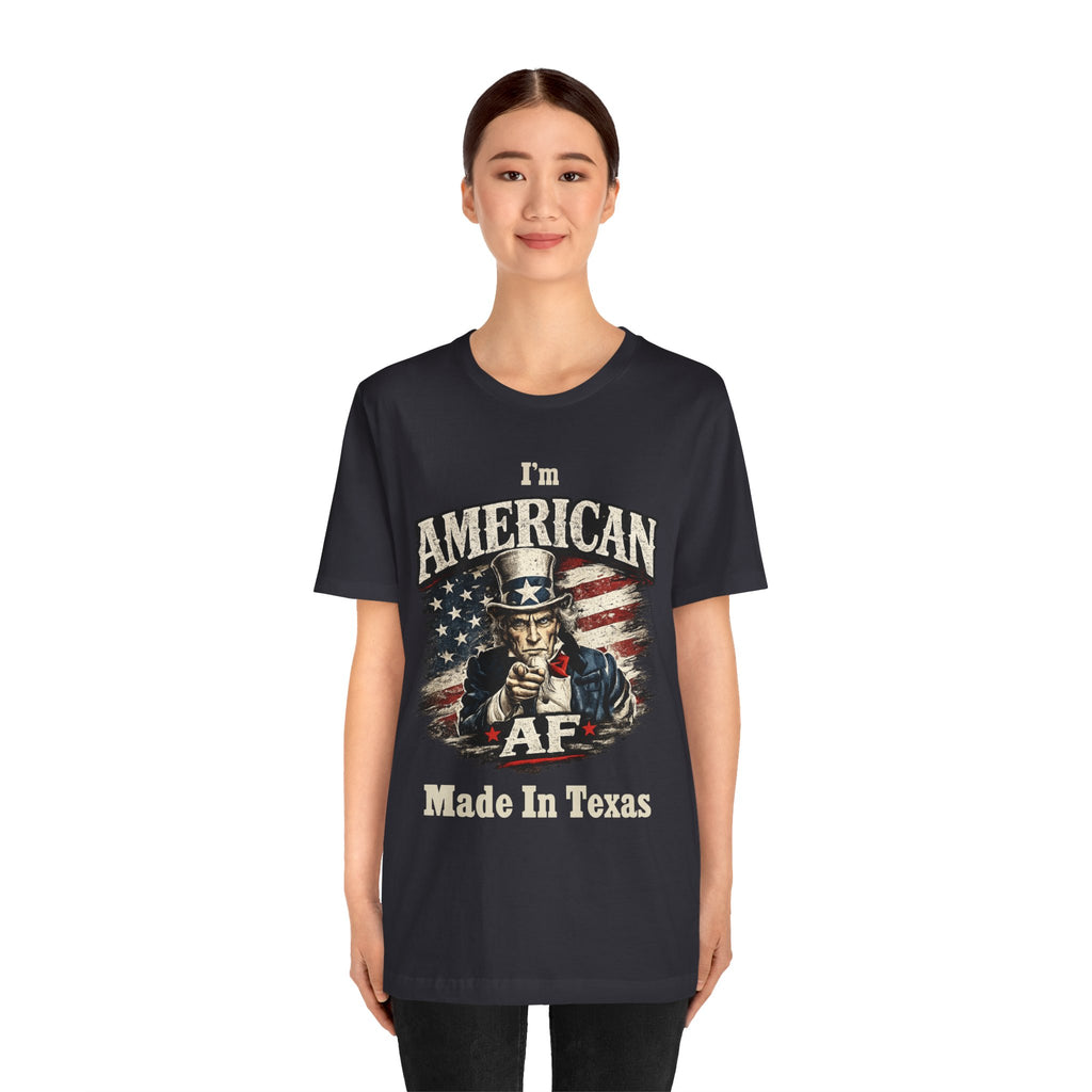 Navy t-shirt worn by a female model facing forward, full Uncle Sam AF Made In Texas graphic visible.