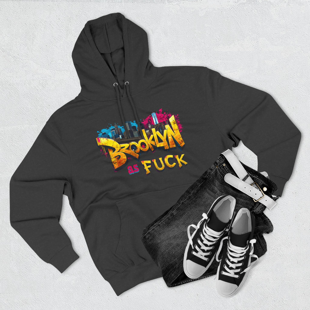 Charcoal heather hoodie styled flat lay with jeans, belt, and sneakers, graffiti Brooklyn As Fuck NYC skyline print.