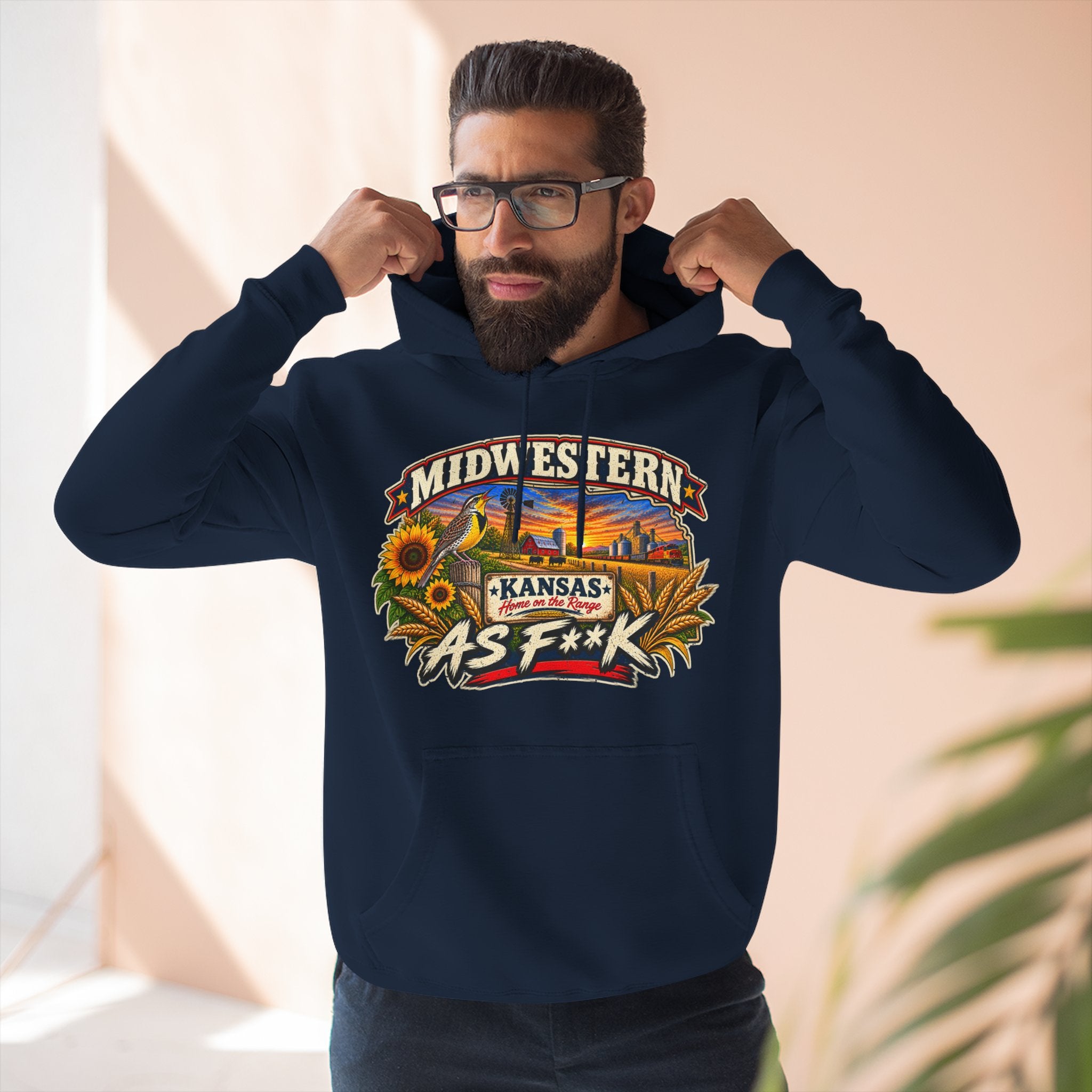 Bearded man wearing the navy Kansas As F**K hoodie, hands on the hood
