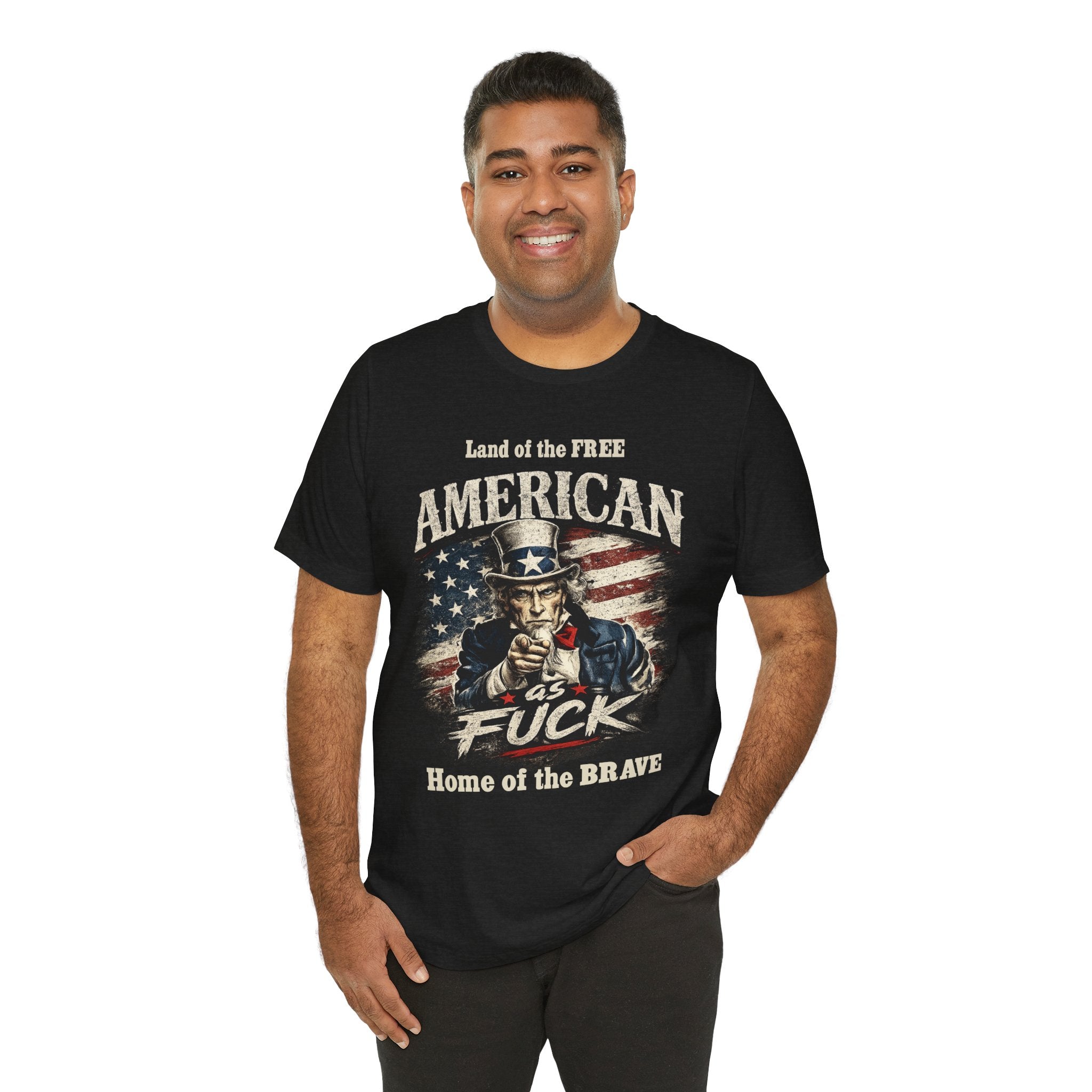 Black t-shirt worn by a smiling model, with Uncle Sam design and 'Land of the Free, Home of the Brave' text