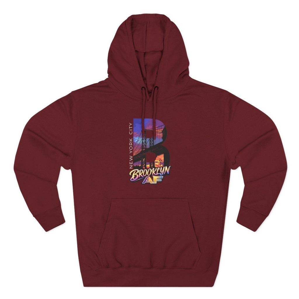 Maroon Brooklyn AF hoodie laid flat, NYC skyline inside a big letter B