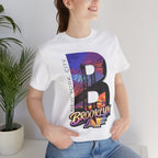 Woman by a houseplant in the White Brooklyn AF tee, skyline B front print