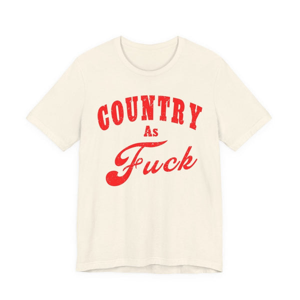 Natural cream Country As Fuck tee laid flat with arched red lettering — the Country graphic tee collection