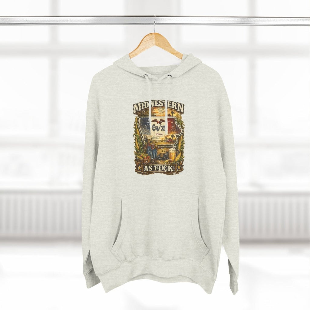 Oatmeal Heather Iowa Midwestern As Fuck hoodie on a wooden hanger by a window