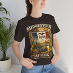 Woman beside a potted plant wearing the Brown Iowa Midwestern As Fuck tee