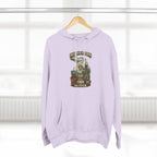 Lilac Michigan Midwestern As Fuck hoodie hanging on a wooden hanger by a window