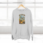 Heather Grey Wisconsin Midwestern As Fuck hoodie on a wooden hanger by a window