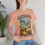 Woman beside a potted plant wearing the Heather Peach Wisconsin Midwestern As Fuck tee