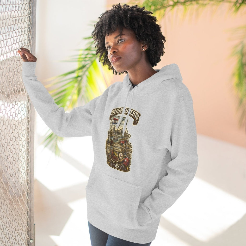 Woman at a sunlit window in the Heather Grey Missouri Midwestern AF hoodie