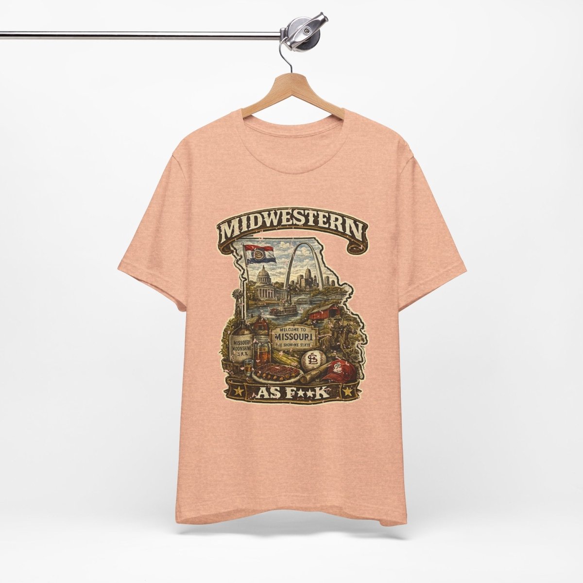 Heather Peach Missouri Midwestern As F**K tee on a metal hanger against a white wall