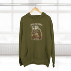 Army Green Missouri Midwestern As Fuck hoodie on a wooden hanger by a window