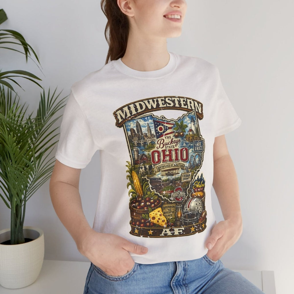 Woman in the White Ohio Midwestern AF tee beside a plant, front print showing