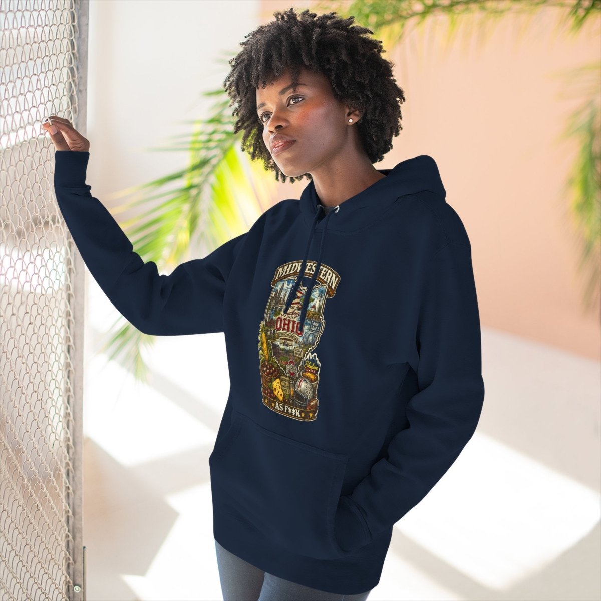 Woman by a sunlit window in the Navy Ohio Midwestern As F**K hoodie