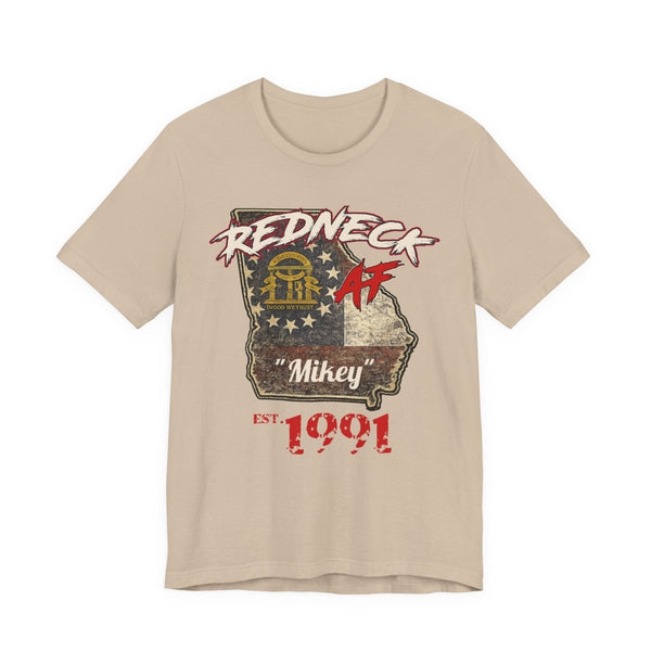 Tan Redneck AF Georgia tee laid flat, Georgia state outline with sample name Mikey and EST 1991